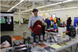 Readiness Fair Newport 2014 - Man Smiling While Holding Red Backpack