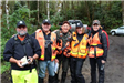 Group of People Outfitted for Search and Rescue