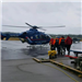 People Walking Toward Helicopter