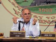 Budget Committee member talking into microphone.