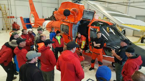 People Gathered Around a Helicopter