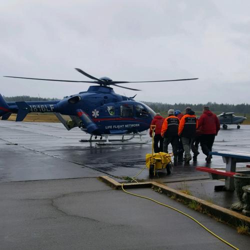 People Walking Toward Helicopter