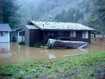 Home and Boat Impacted by Flooding