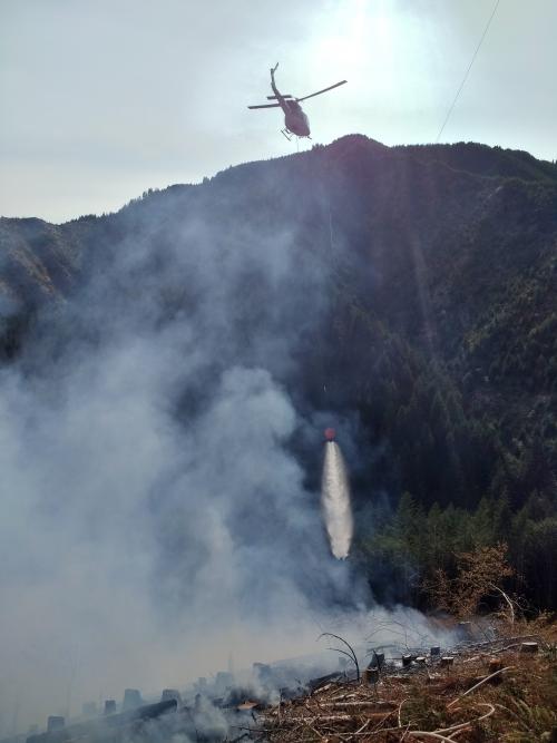 Fall Creek Road Fire - Helicopter Pouring Water over the Fire - July 30, 2018