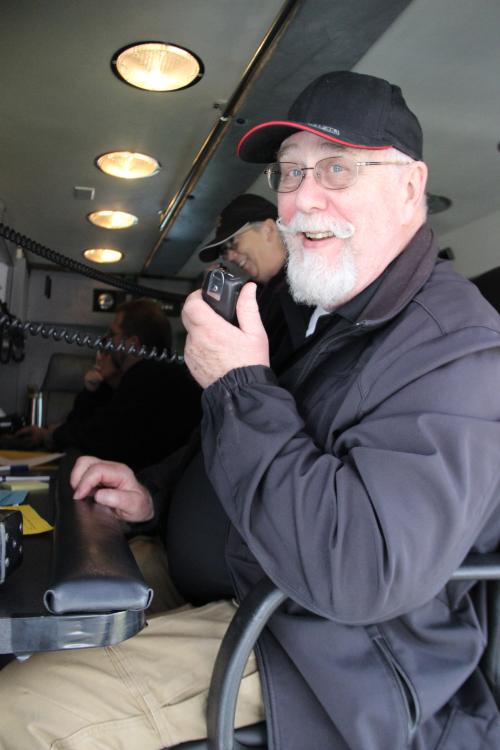 Man Speaking into a Two-Way