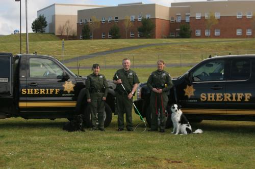 Three Officers and Dog