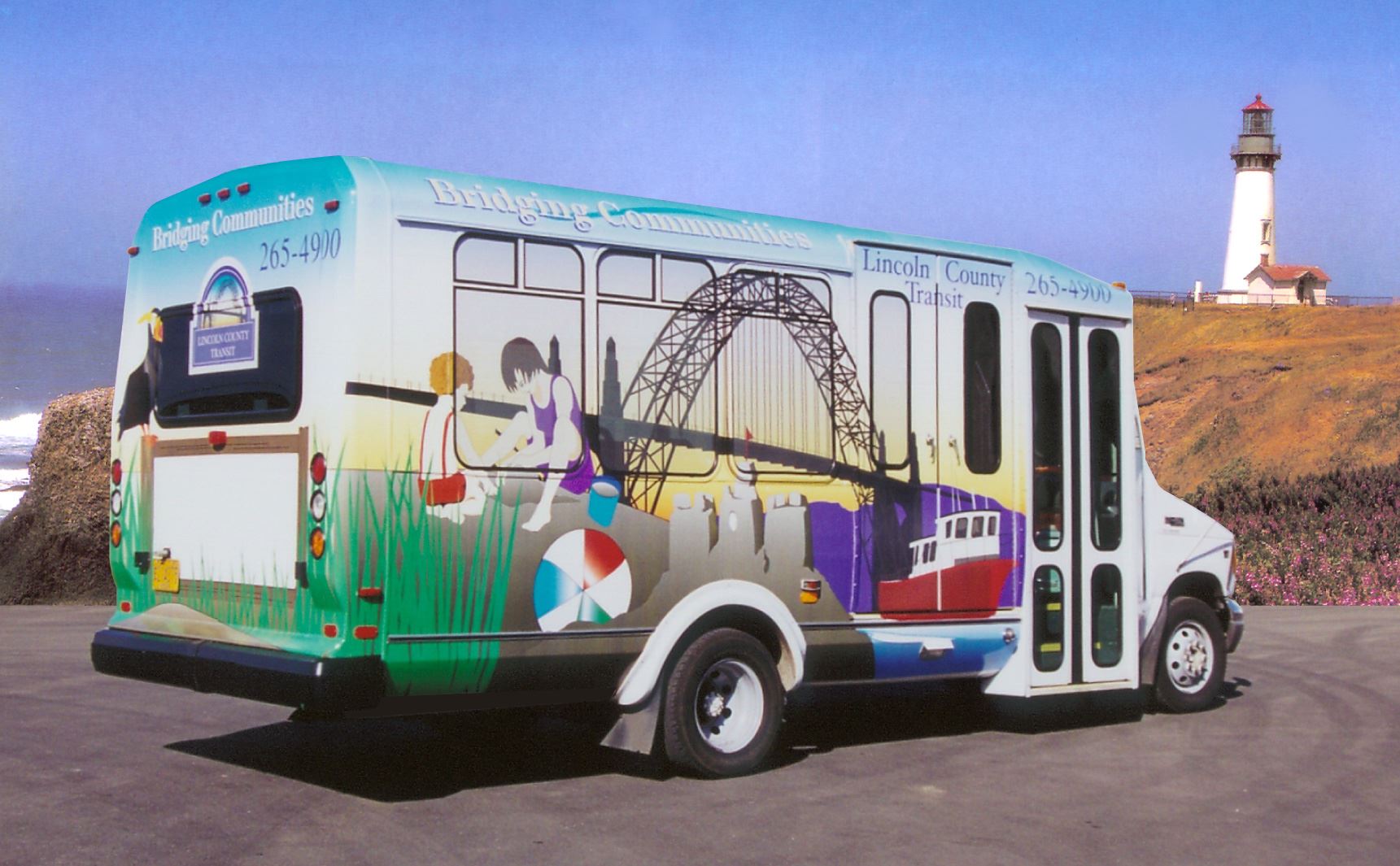 A transit bus parked in front of a lighthouse